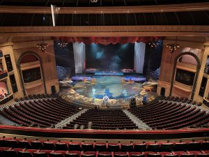 The interior of a large theater, taken from the very back.