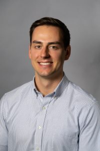 man infront of gray background