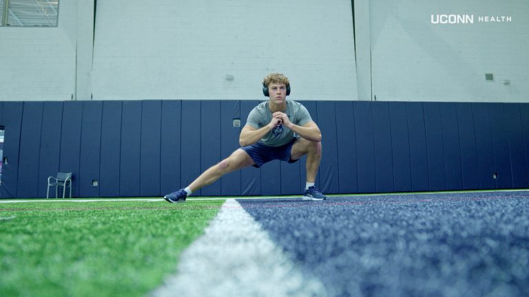 UConn football wide receiver Jackson Harper physically and mentally preparing before a workout. (Ethan Giorgetti/UConn Health)