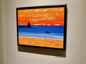 A painting of an orange sky and beach separated by a blue swath of water.