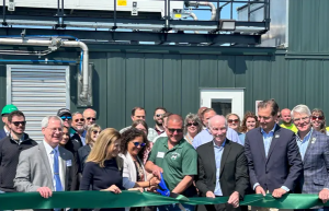 A group of people at a ribbon-cutting ceremony