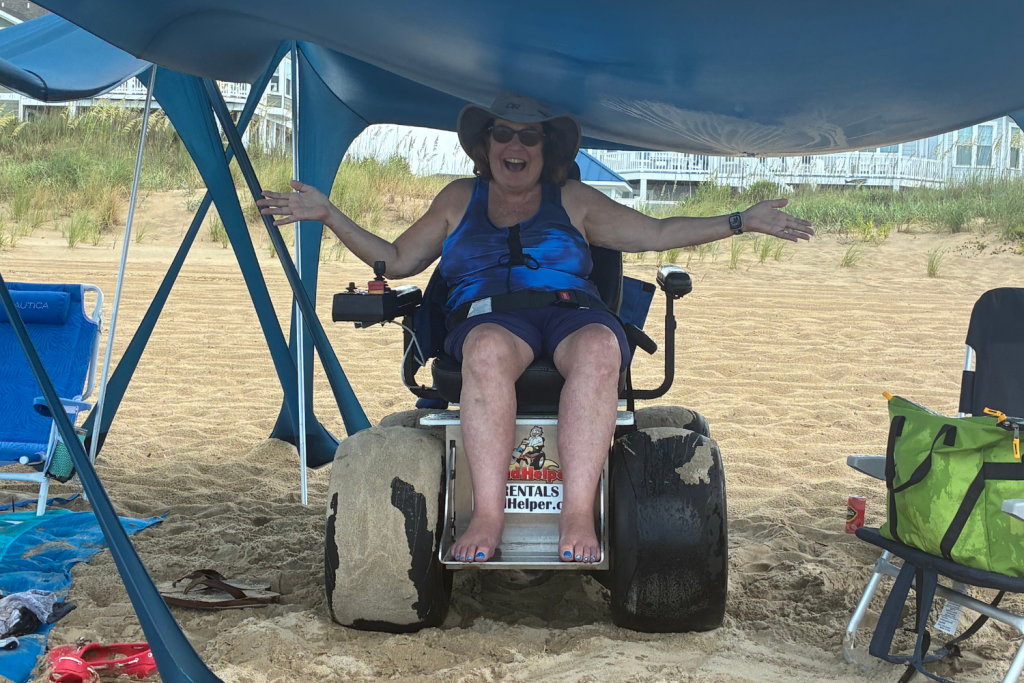 woman sitting in wheelchair on the beach