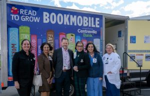 group of people in front of book mobile