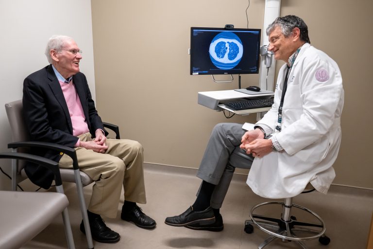 Patient Woody and Dr Metersky happily talking in exam room