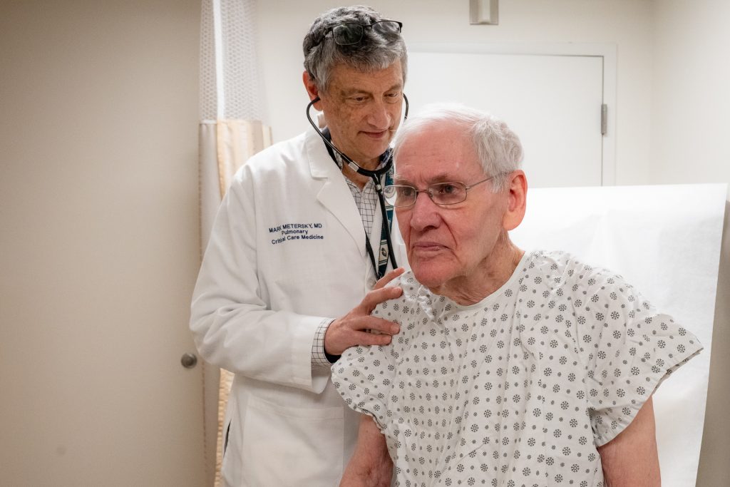 Woody Exley being examined by his longtime pulmonologist Dr. Mark Metersky at UConn Health