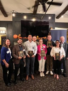 The recipients holding their awards