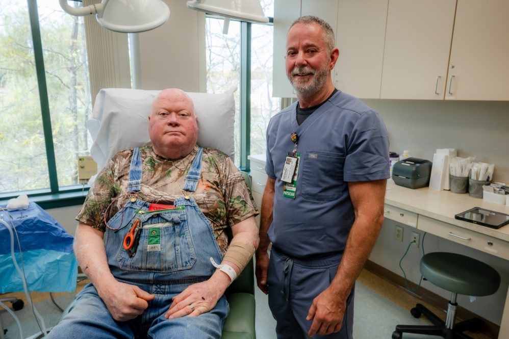 In exam room together - Veteran Dr. Brett Sloan with his longtime patient and fellow Veteran Michael Puttin