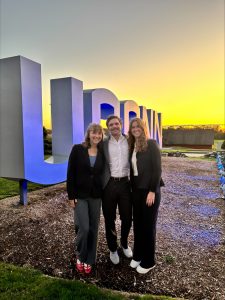 UConn's winning FDRS team outside the UConn sign.