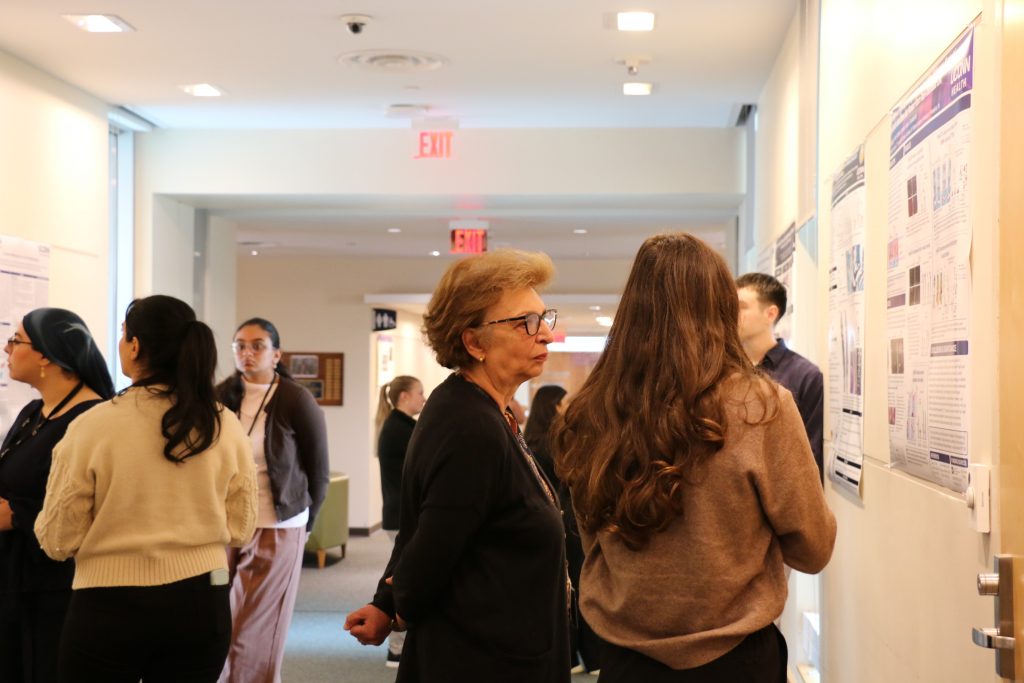 two women looking at posters
