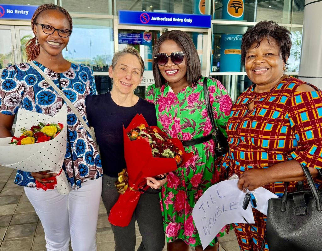 UConn's Dr. Jill Wruble arriving to the airport in Zambia to flowers and a warm welcome.