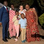 Dr. Jill Wruble smiling happily with Veronica and family