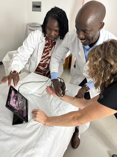 two residents learning handheld ultrasound