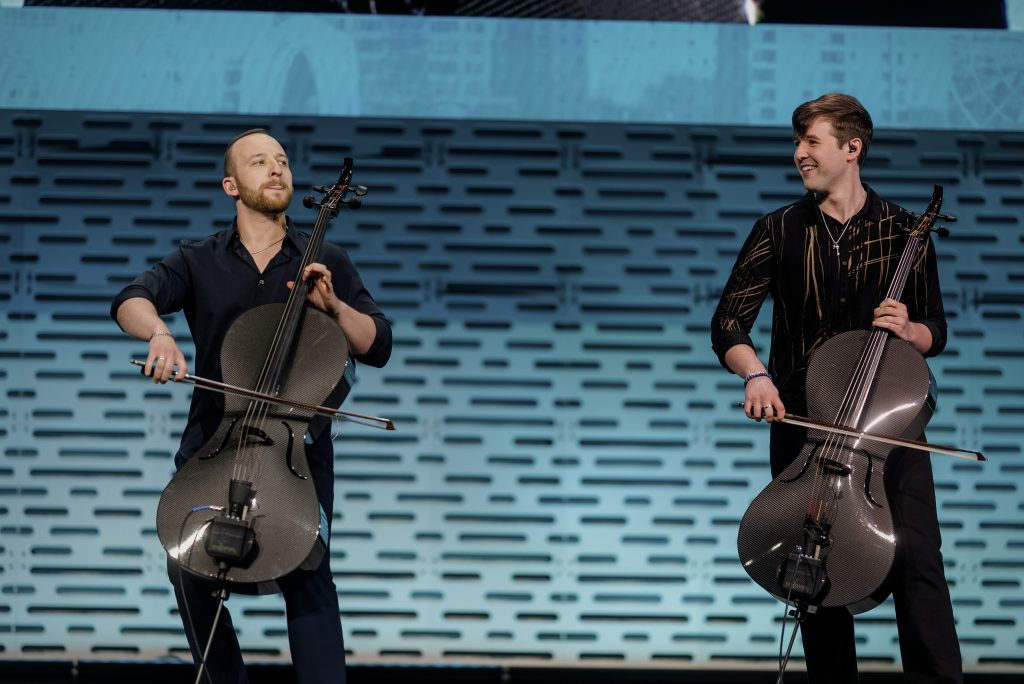 two men playing cello