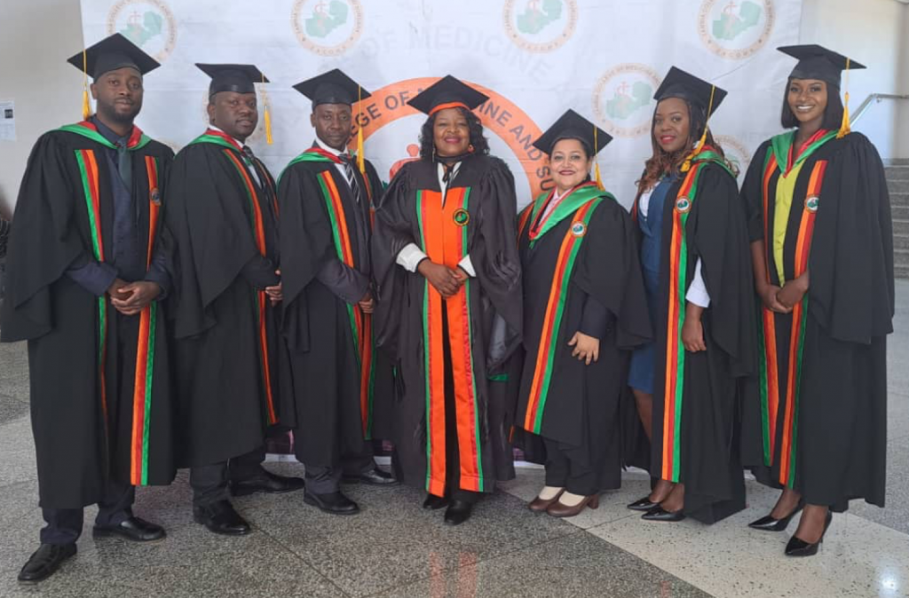 Wearing cap and gowns Zambia's new radiologists graduating from the new residency program.