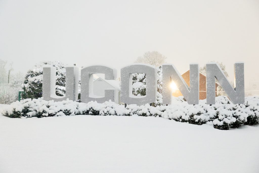 UConn gateway sign surrounded by snow