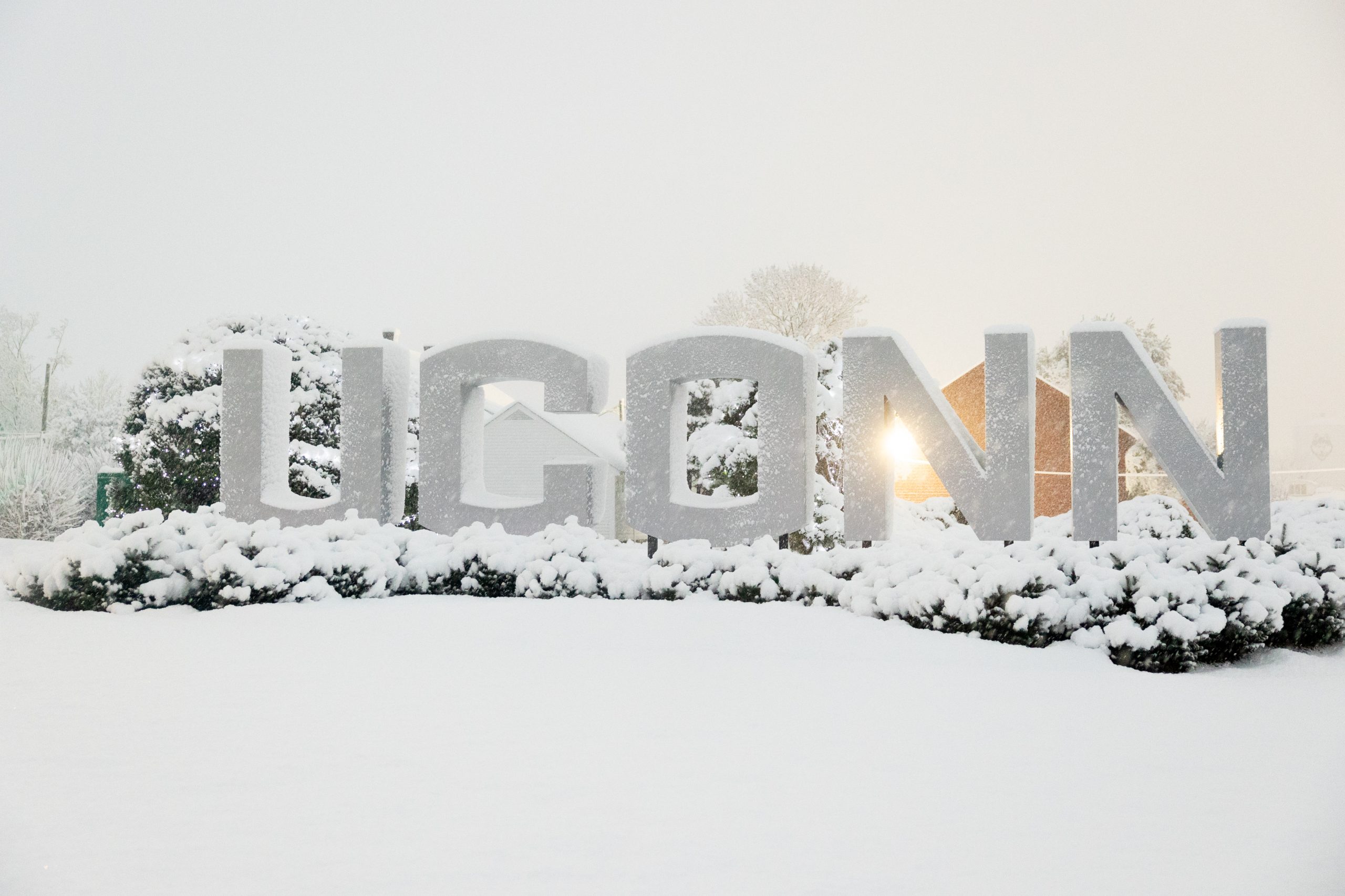 UConn gateway sign surrounded by snow