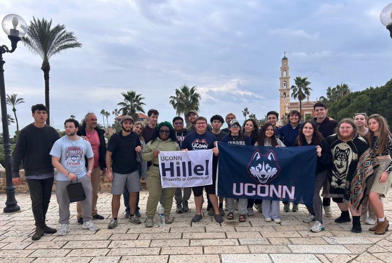 A group of UConn students pose for a photograph in Israel