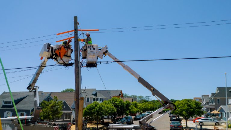 Workers repair telecommunication cable