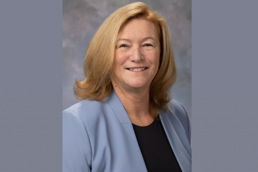Photo of Dr. Rachel M. Stanley in blue blazer smiling.