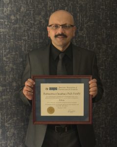 Bodhi holding his AAPS Fellow Award