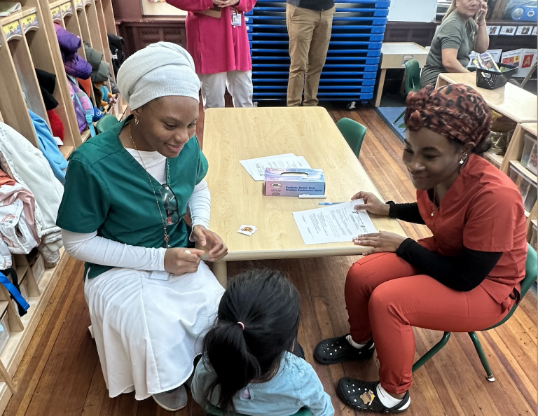 two students with preschooler