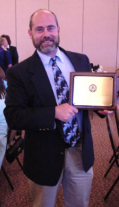 Steven Zinn receiving the FYE Teaching Excellent Award in 2001