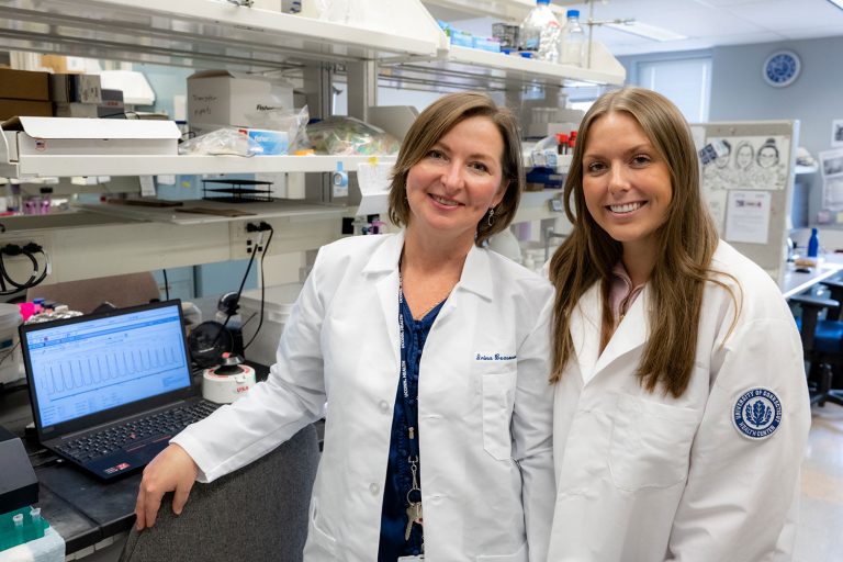 portrait two women in lab coats in lab
