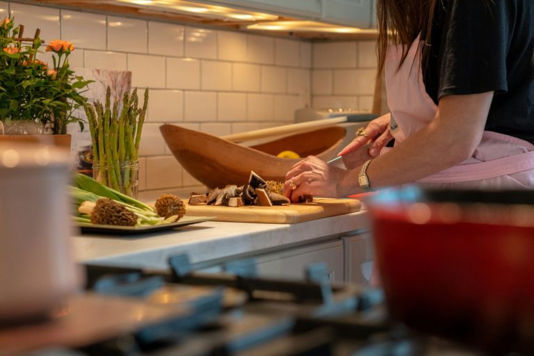 Woman in kitchen preparing food