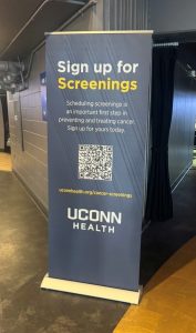 a sign that says sign up for cancer screenings