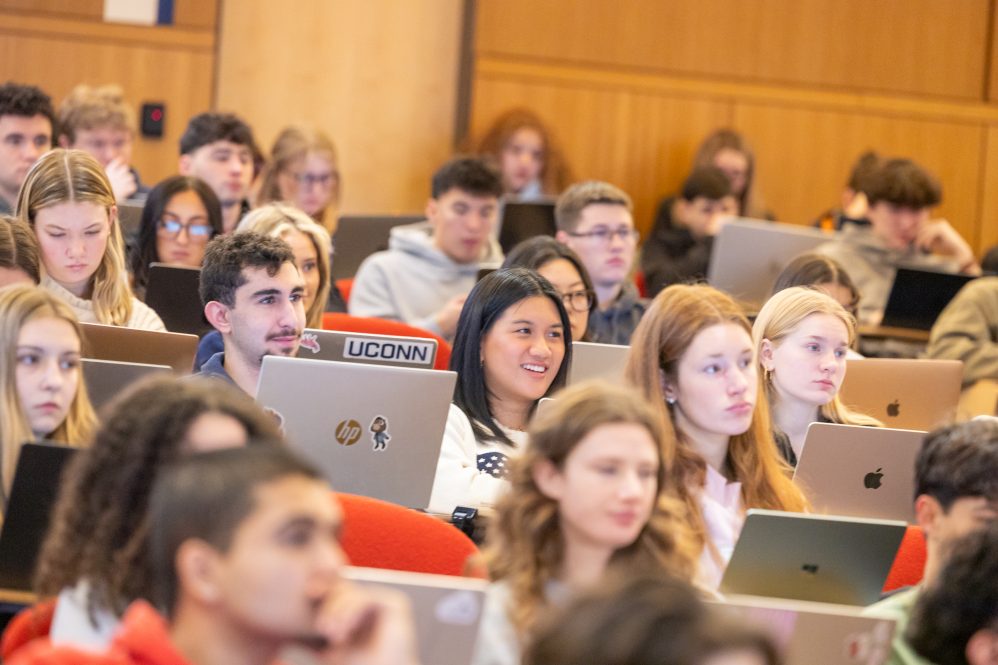 UConn students sit in a political science class