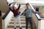 Students celebrating their matches in academic lobby