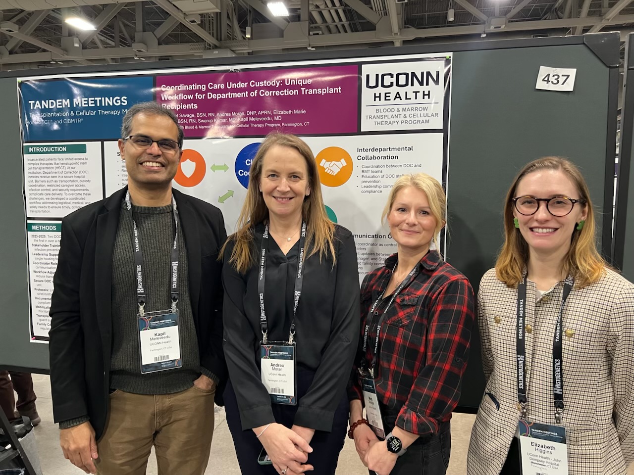 BMT team at Tandem Meetings in front of poster