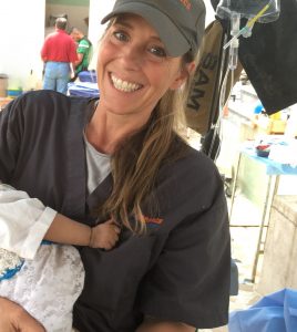 Katherine Bequary holding a baby.