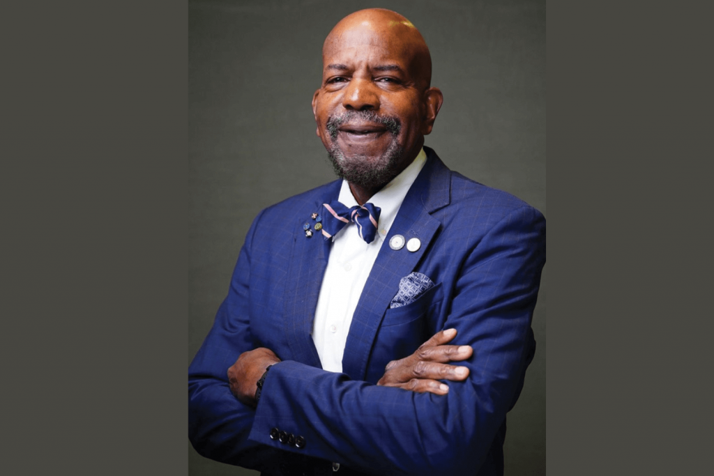 Dr. Cato T. Laurencin of UConn in blue suit with arms crossed.