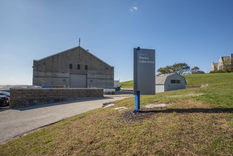 A photo of a building with a sign in front of it