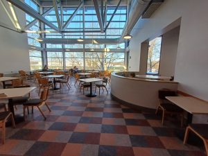 A sunroom featuring dining furniture.