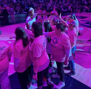 women high fiving another woman
