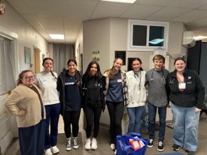 Natalie Crino with volunteers and students