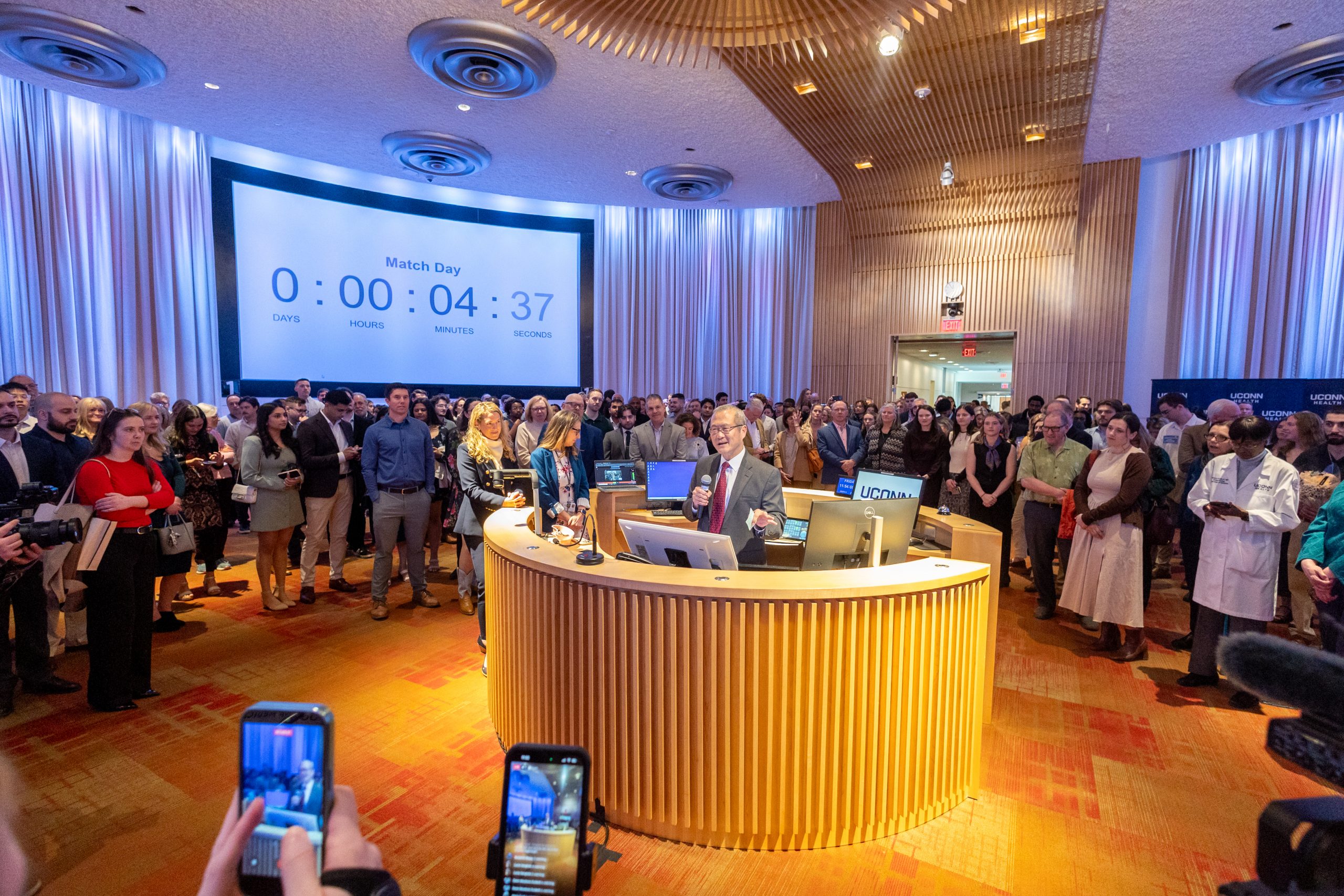 Dean Dr. Bruce Liang sharing remarks before the envelopes are ripped open on National Match Day 2026. (Sydney Herdle/UConn Photo)