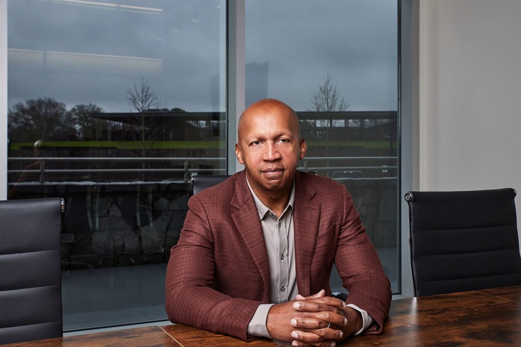 A photo of a man sitting at a table
