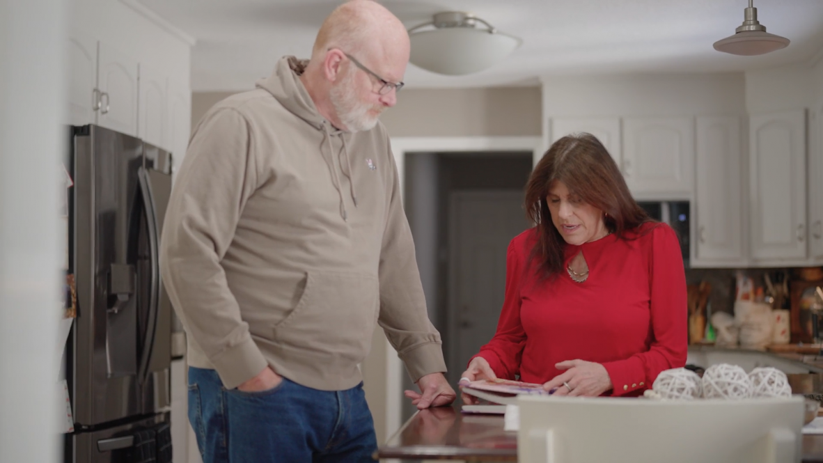UConn Health patient Christy Seholm talking with her husband at their home. Christy suffers from a potentially fatal genetic blood clot disorder called Factor V. (Ryan Bernat/UConn Health)