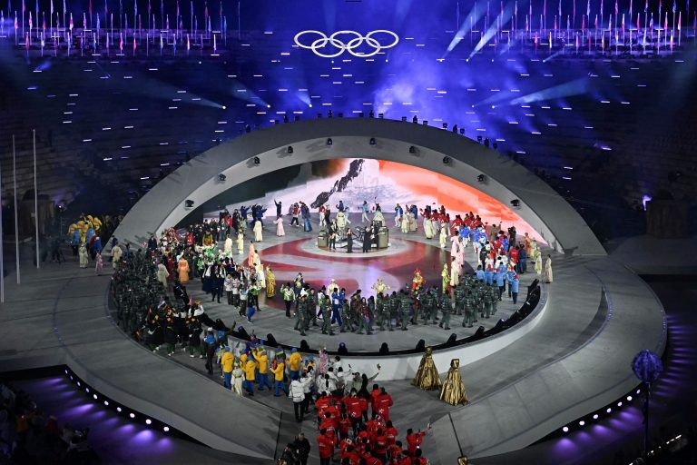 Flagbearers parade during the closing ceremony of the Milano Cortina 2026 Winter Olympic Games at the Verona Arena.