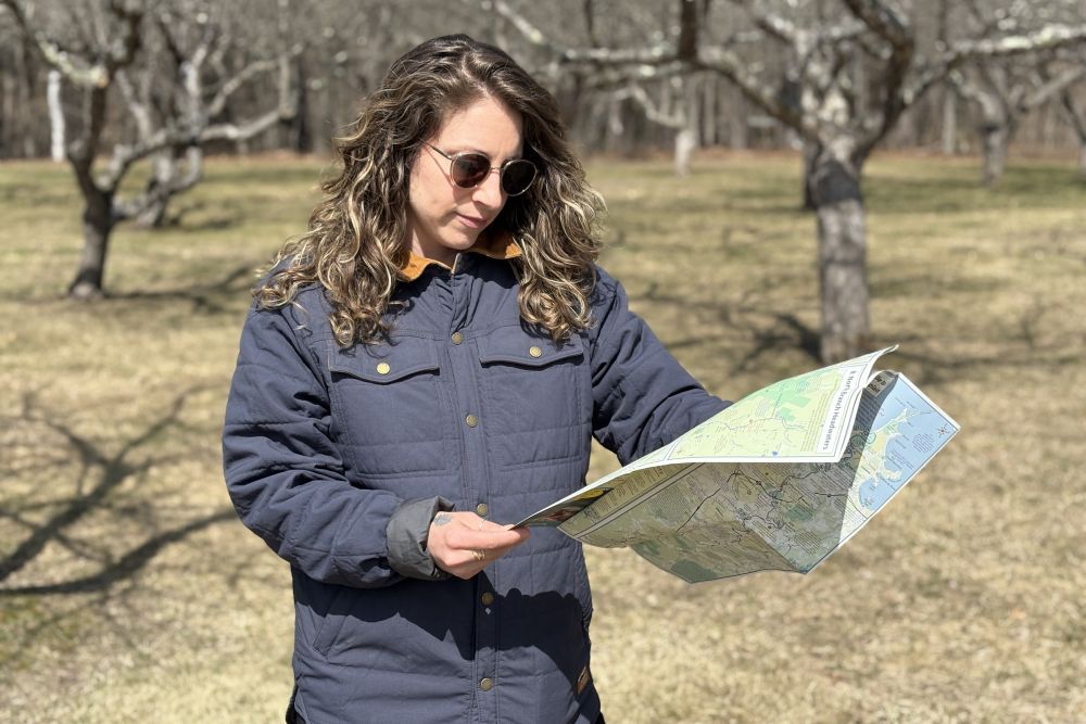 Stephanie Stroud '12 in the field with a map