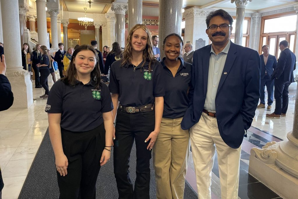 Three students stand with Interim CAHNR Dean Kumar Venkitanarayanan at the Capitol