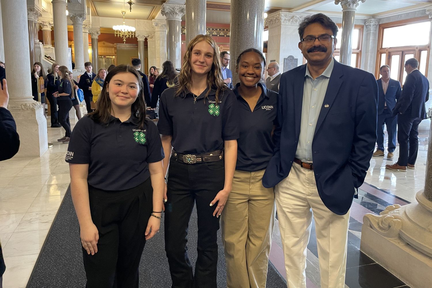 Three students stand with Interim CAHNR Dean Kumar Venkitanarayanan at the Capitol