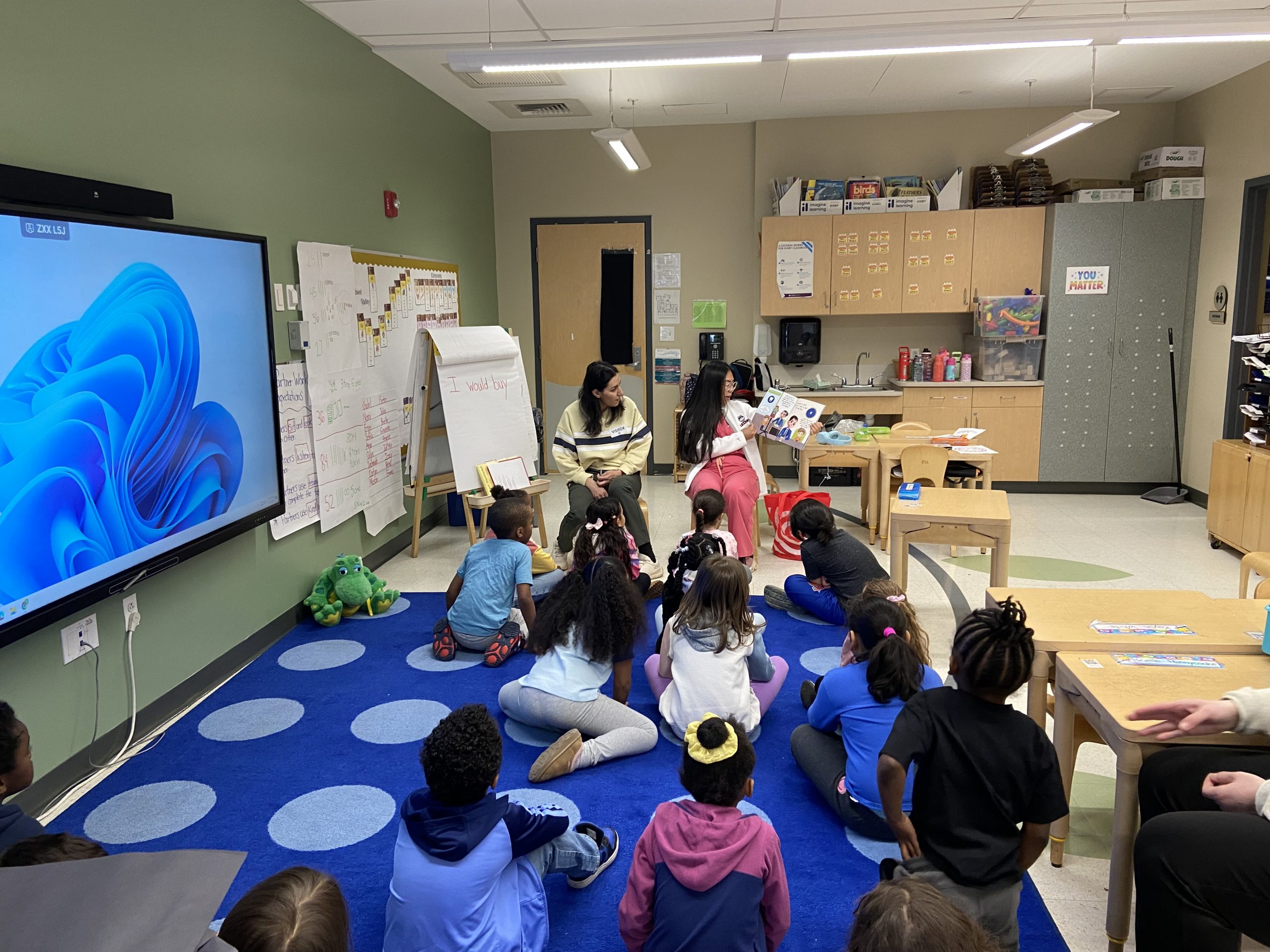 students read to children
