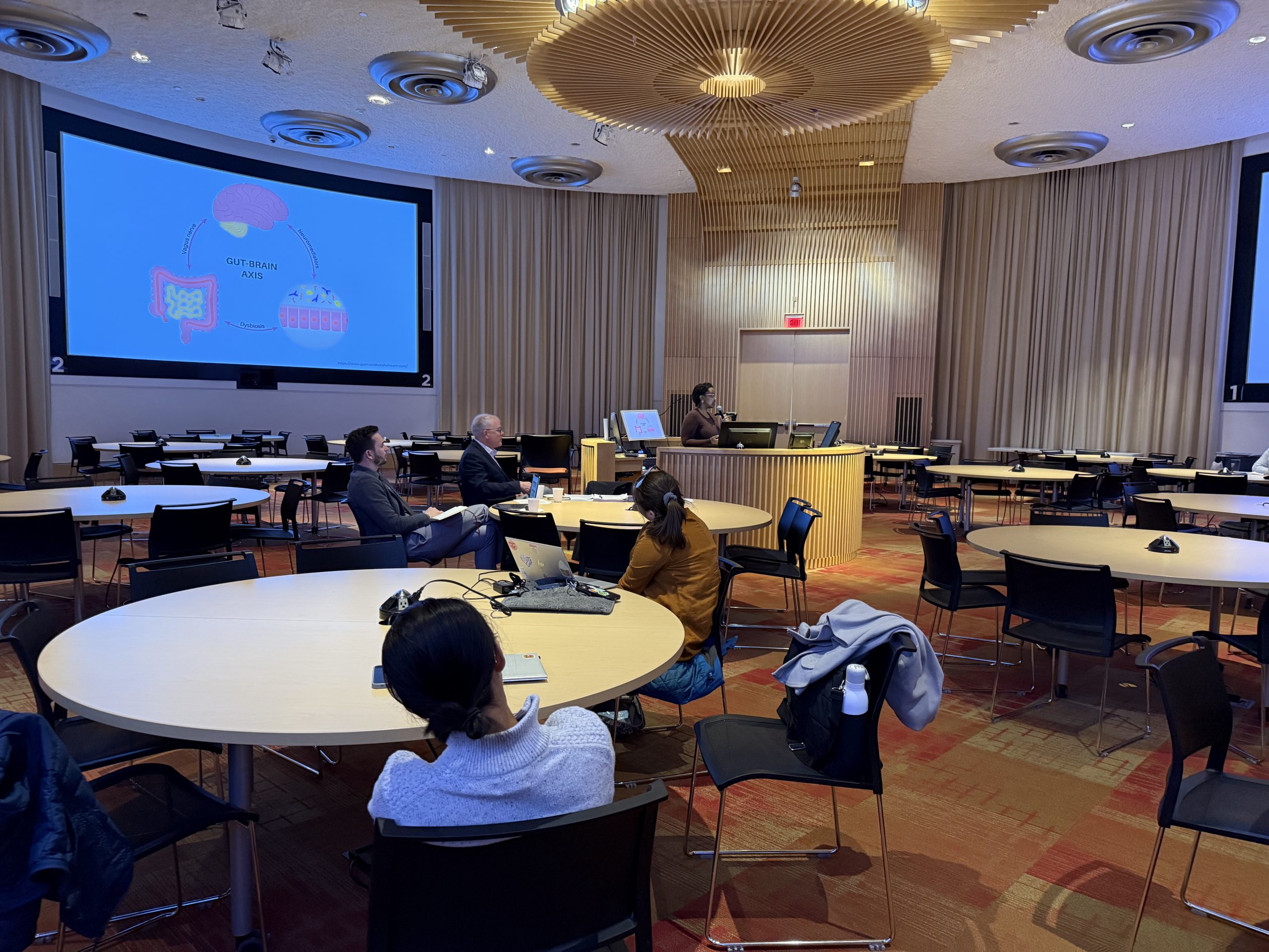 Chelsea Rutagengwa presenting in the Academic Rotunda on March 19, 2026.