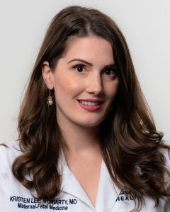 Dr. Kristen Moriarty studio portrait white coat