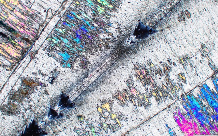 A prismatic close-up shape with rainbow sheen