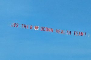 Plane banner: "JV3 Thx &  [heart] UConn Health Team!"